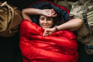 A woman resting in a sleeping bag