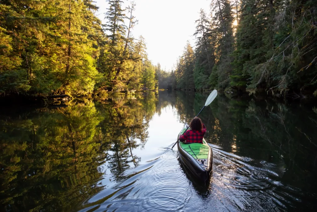 A girl kayaking in a river-best river kayak